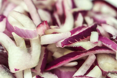 Red onion sliced close up backgroundの写真素材