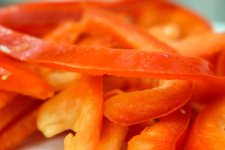 Red pepper sliced julienne closeupの写真素材