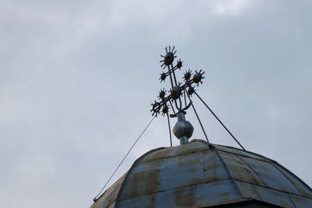 Iron cross on sheet church