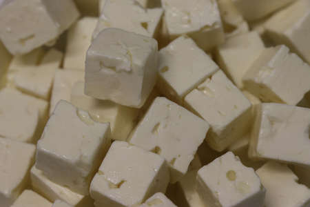 Feta cheese cubes in closeup scene
