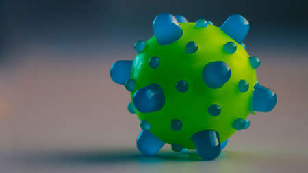 A spherical soft toy in focus