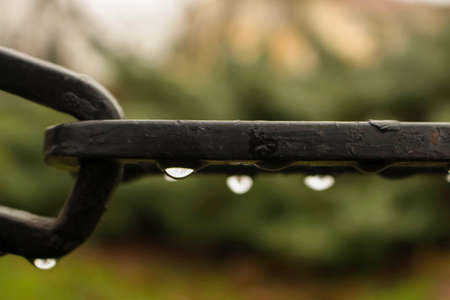 An iron black chain wet and blur