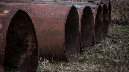 Large iron tubes outside background