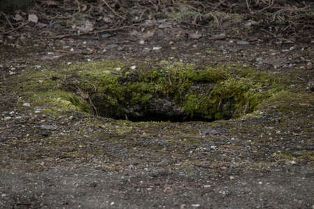 A hole in the ground backgroundの写真素材