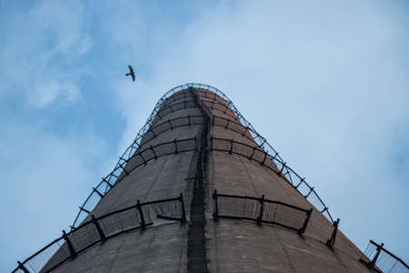 Look up to a concrete tower and ladderの写真素材