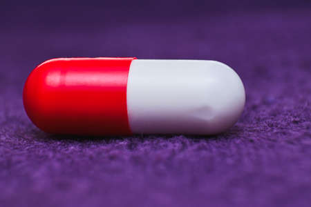 Red and white pill close
