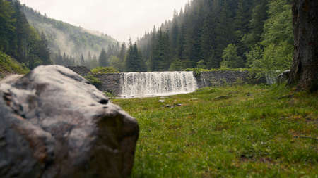 A small waterfall and boulder viewの写真素材