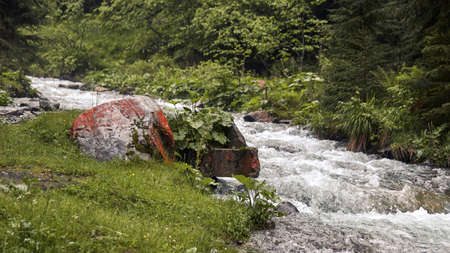 A large boulder near river view