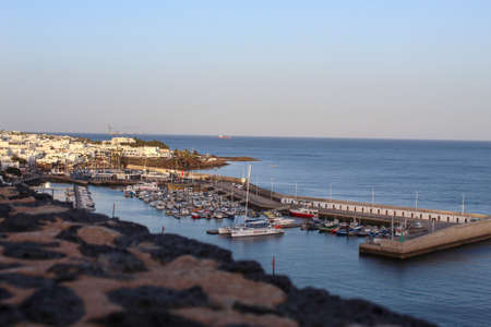 seaport seen from above with many boats and clear water clear skyの写真素材