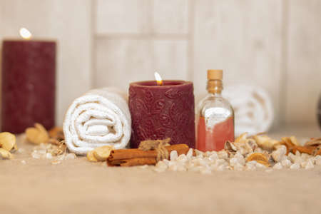 The natural oil and spa essentials near the candles for aromatherapyの写真素材