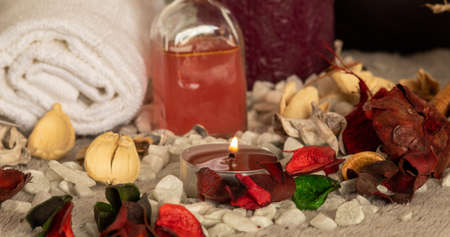 The natural oil and spa essentials near the candles for aromatherapyの写真素材