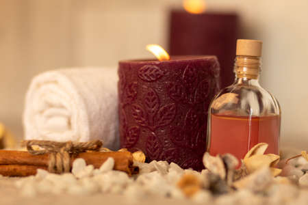 The natural oil and spa essentials near the candles for aromatherapyの写真素材