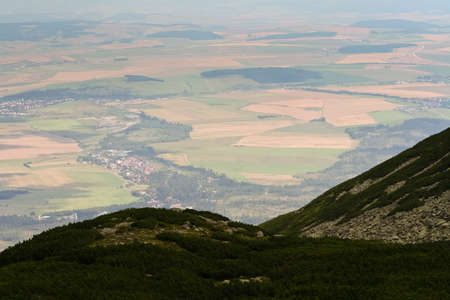 landscape with mountains in slovakia, high tatras, view of the earth from a great height, the villages and the fields, mountainsの写真素材
