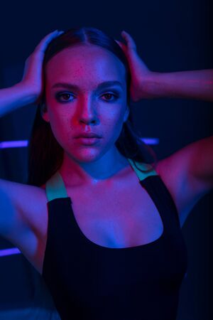 Studio portrait of a beautiful attractive athletic slim gir.
