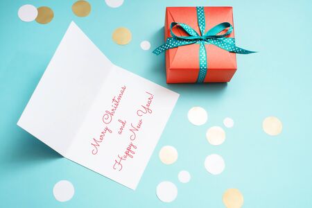 Decorated boxes, confetti and Christmas greeting card.の写真素材