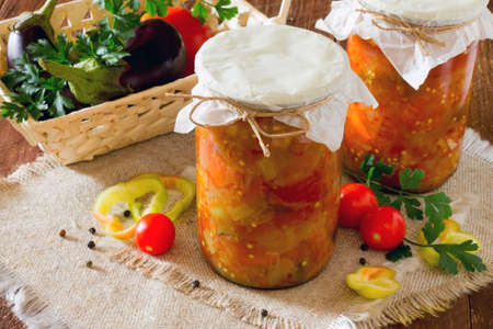 Home eggplant salad and vegetables on a wooden tableの写真素材
