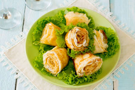 Stuffed pancakes rose cream cheese cottage cheeseの写真素材