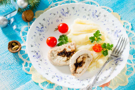 Chicken roll with prunes and nuts in a New Year's Eveの写真素材
