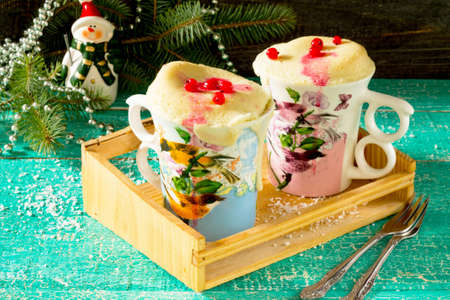 Quick food cake in a mug on a table in the New Year's Eveの写真素材