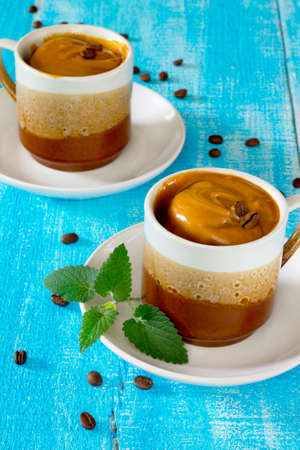Cupcakes in a mug with butter cream in rustic style