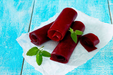 Traditional oriental sweets - candy cherry on a wooden table, selective focus.の写真素材