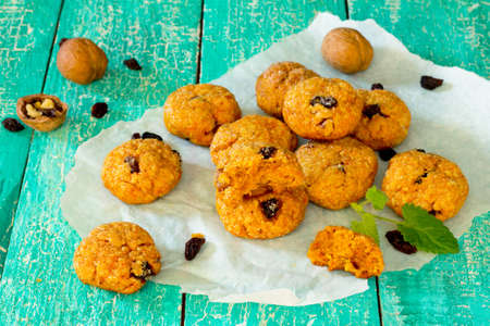 Oatmeal cookies with carrots and walnuts, selective focus.の写真素材