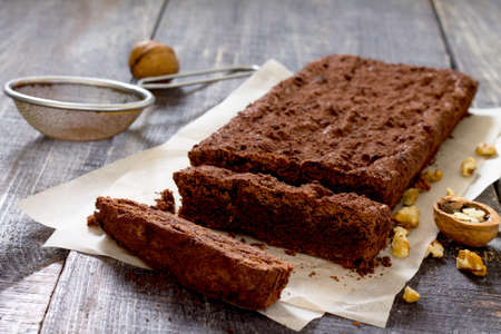 Chocolate brownie cake on a dark wooden table