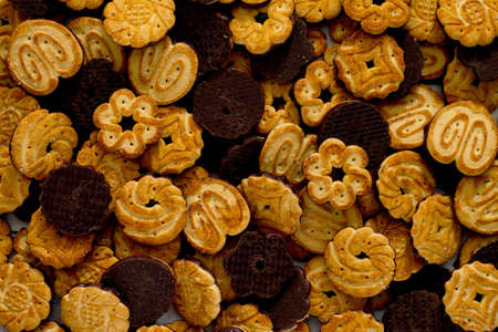 Cookies with chocolate glaze on the table, top view.