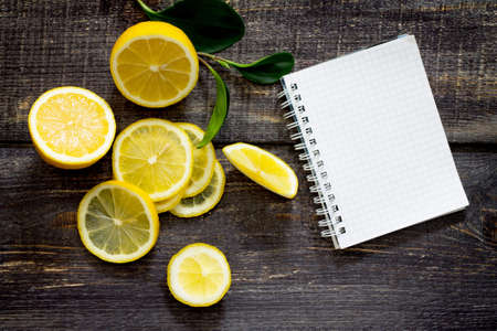Fresh lemons on the table, space for text.の写真素材