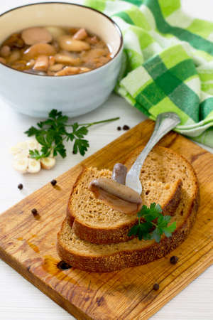 Marinated mushrooms boletus served with bread in rustic styleの写真素材