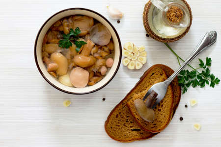 Marinated mushrooms in a ceramic bowl, top view, selective focus.の写真素材