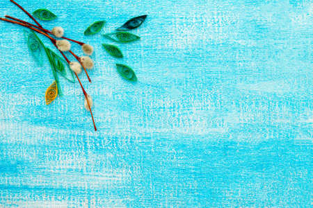 Easter composition quilling technique on a blue wooden background