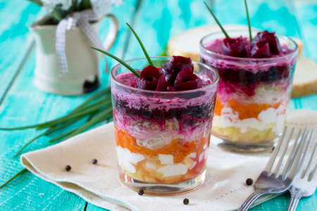 Salad with beets, apple, radish, carrots, potatoes, chicken egg, selective focus.の写真素材