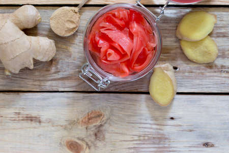 Ginger root and slices of pickled ginger, selective focus.の写真素材