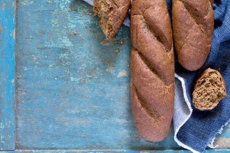 Rye bread on a vintage wooden blue background. Top view .