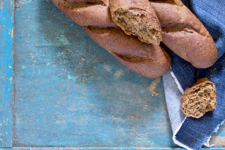 Rye bread on a vintage wooden blue background. Top view .の写真素材