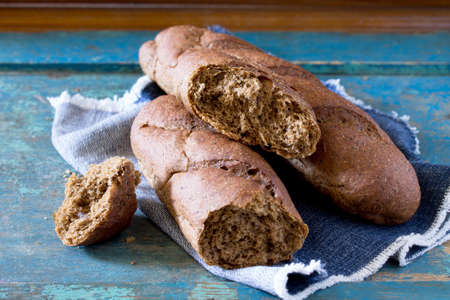 Rye bread on a vintage wooden background. Space for your text.