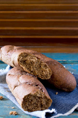 Rye bread on a vintage wooden background. Space for your text.