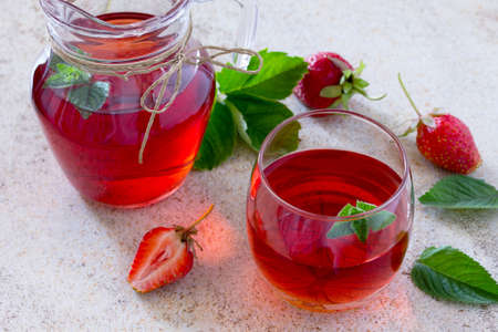 Tradition Summer juice drink with strawberries and mint with copy space on the stone background.の写真素材