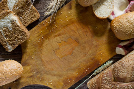 The different whole wheat bread, baked in the home, organic ingredients. Food background. Top view, copy space.の写真素材