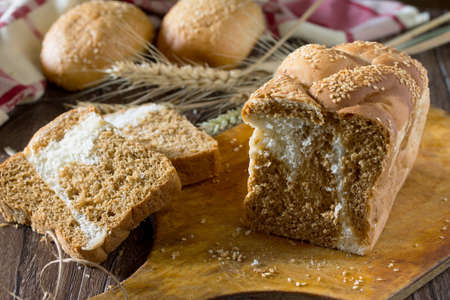 The different whole wheat bread, baked in the home, organic ingredients. Food background.
