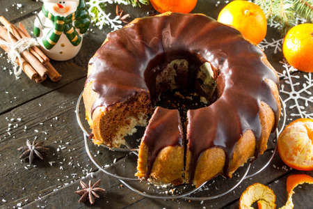 Traditional homemade cupcake with chocolate icing. Christmas holiday dessert in the New Year tree...
