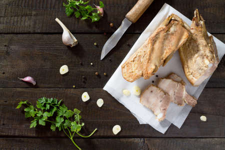 Raw meat layer. Raw Raw lard from pork on a cutting board with garlic and spices.の写真素材