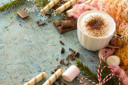 Coffee with whipped cream, a cup of cappuccino. Christmas frame. Copy space.