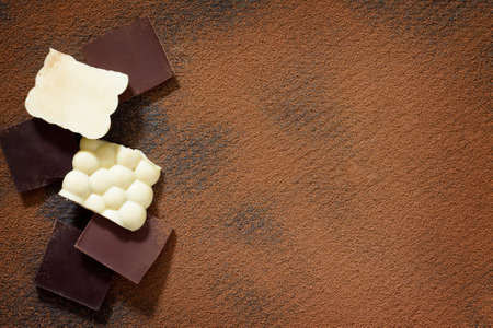 Chocolate bubbles mix, pastries and desserts, a chocolate background. Copy space.