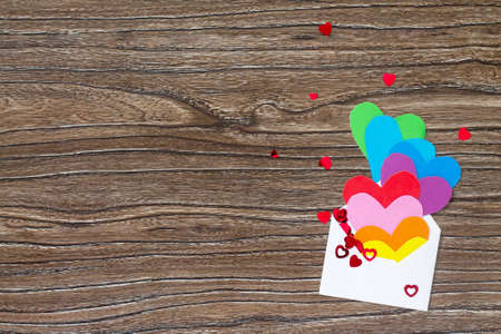 Birthday, Mother's Day or Valentine background. Heart from paper rainbow, sending love and rosy wishes. Copy space.の写真素材