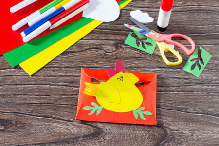 The child create Easter card envelope letter chicken. Handmade. Children's Art Project, needlework, crafts for children.の写真素材