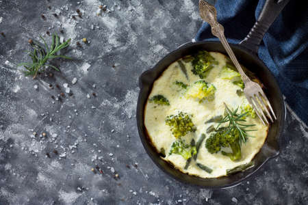 Breakfast background. Omelette with broccoli and green beans. The concept of a healthy diet and detox diet.の写真素材
