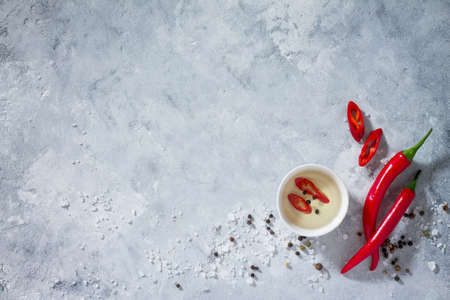 Culinary background gray stone for cooking with chili and spices, copy space, top view.の写真素材