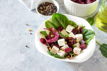 Healthy homemade vegetable salad with beets and nuts. The concept of a healthy diet and detox diet. Copy space.の写真素材